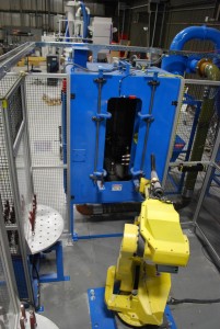 two blast processes combined in a single work cell with a machine tending robot